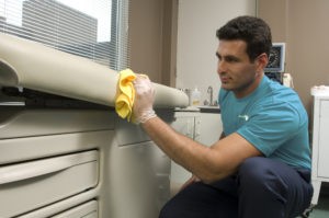 Man Washing hospital bed