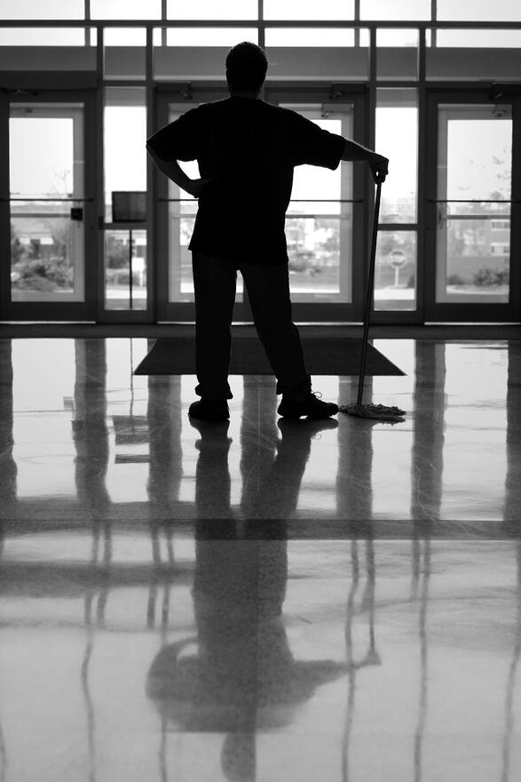 Man standing in front of windows